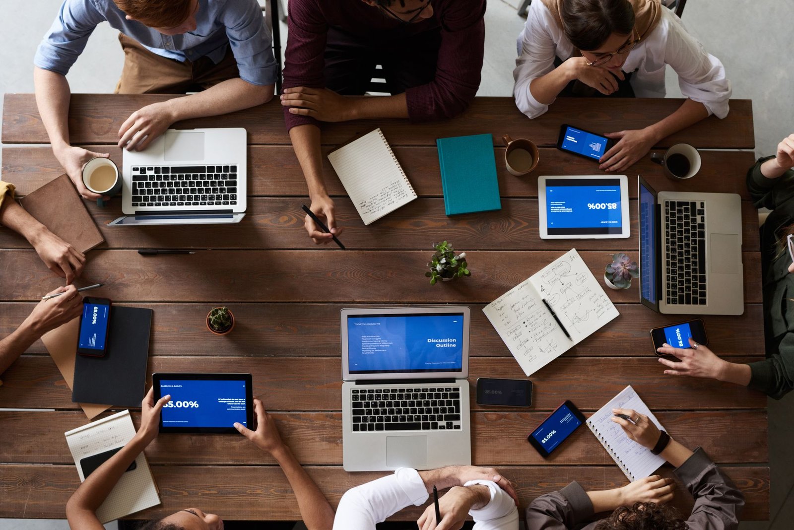 Marketing team reviewing campaign performance together at a laptop